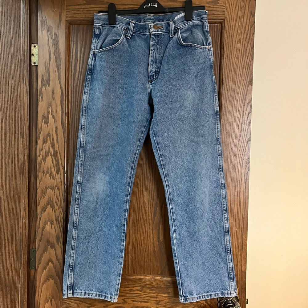 Thrifted men’s jeans for women
